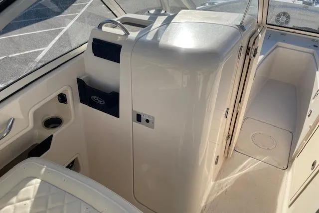Slide: The Image of 2022 Grady-White Freedom 235 boat interior with seating and storage compartments. - 16