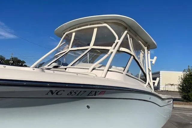 Slide: The Image of 2022 Grady-White Freedom 235 boat with clear skies in the background. - 3
