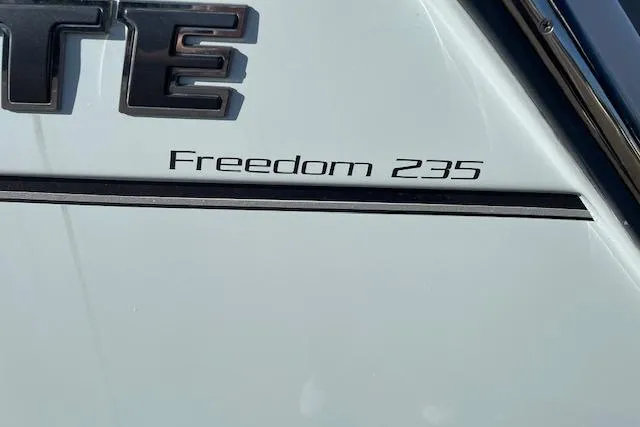 Slide: The Image of 2022 Grady-White Freedom 235 boat model nameplate on hull. - 5