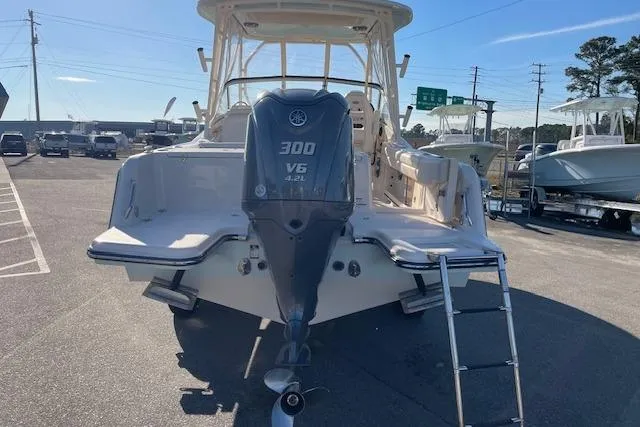 Slide: The Image of 2022 Grady-White Freedom 235 boat with Yamaha 300 V6 engine, parked outdoors. - 8