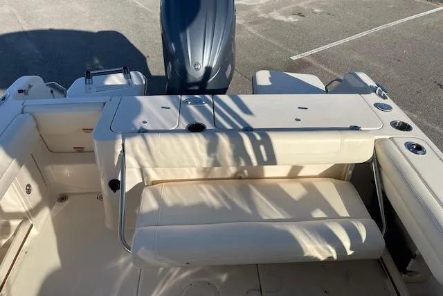 Slide: The Image of 2022 Grady-White Freedom 235 boat interior with seating and engine view. - 9