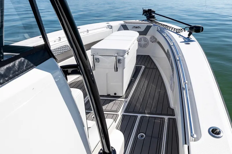 Slide: The Image of 2022 Invincible 33 Open Fisherman boat interior with cooler and sleek deck design. - 13
