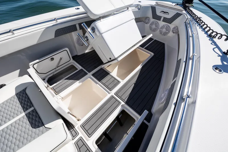 Slide: The Image of 2022 Invincible 33 Open Fisherman boat interior with storage compartments and seating. - 19