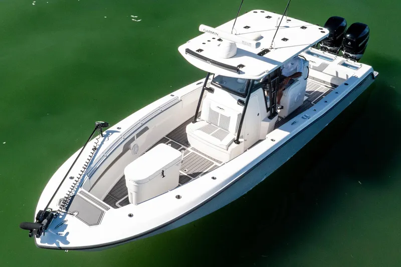 Slide: The Image of 2022 Invincible 33 Open Fisherman boat on calm green water. - 4