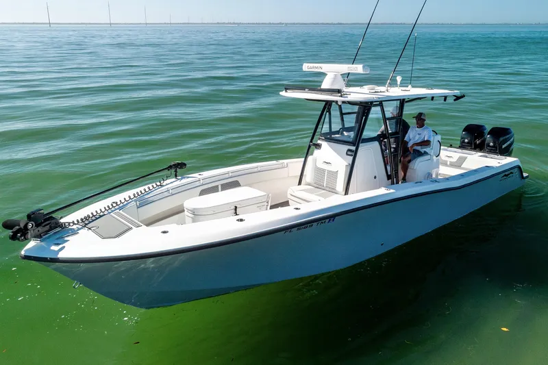 Slide: The Image of 2022 Invincible 33 Open Fisherman boat on calm green water. - 6