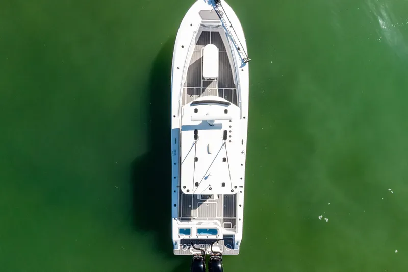 Slide: The Image of Aerial view of 2022 Invincible 33 Open Fisherman boat on green water. - 7