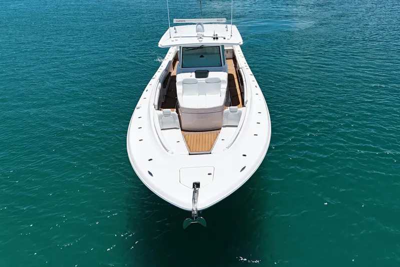 Slide: The Image of 2020 HCB 53 Sueños boat on clear blue water, aerial view. - 10