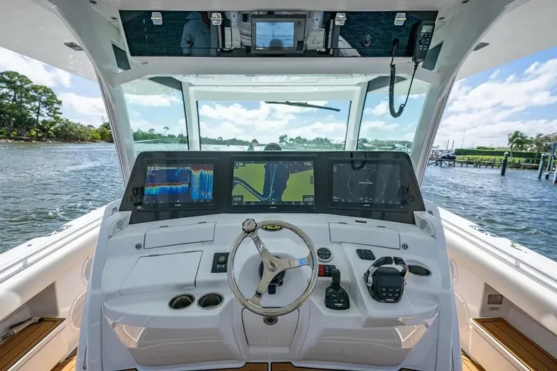 Slide: The Image of Helm of 2020 HCB 53 Sueños boat with advanced navigation displays and controls. - 16
