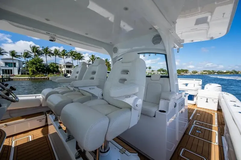 Slide: The Image of Luxury interior of 2020 HCB 53 Sueños yacht with plush seating and scenic waterfront view. - 17