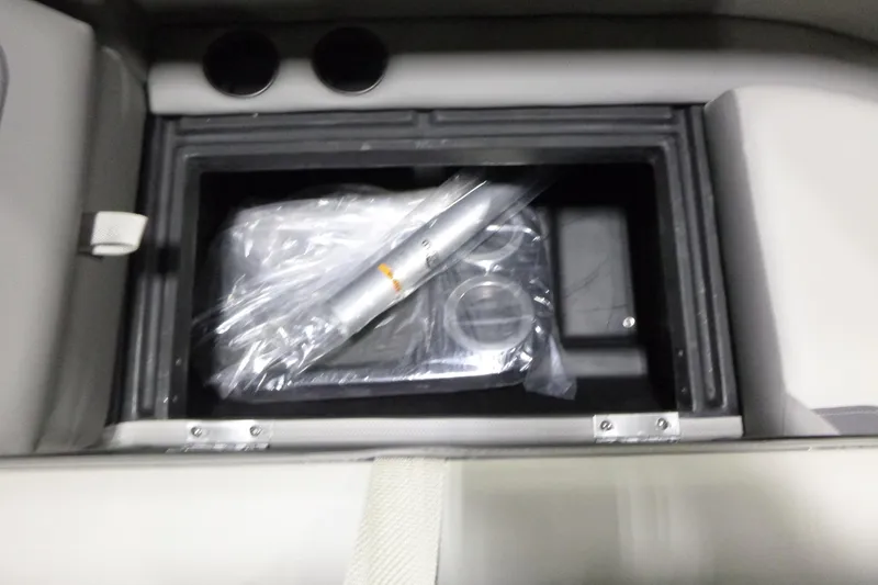 Slide: The Image of Storage compartment in 2026 Premier 220 SUNSCAPE RL boat with accessories inside. - 10