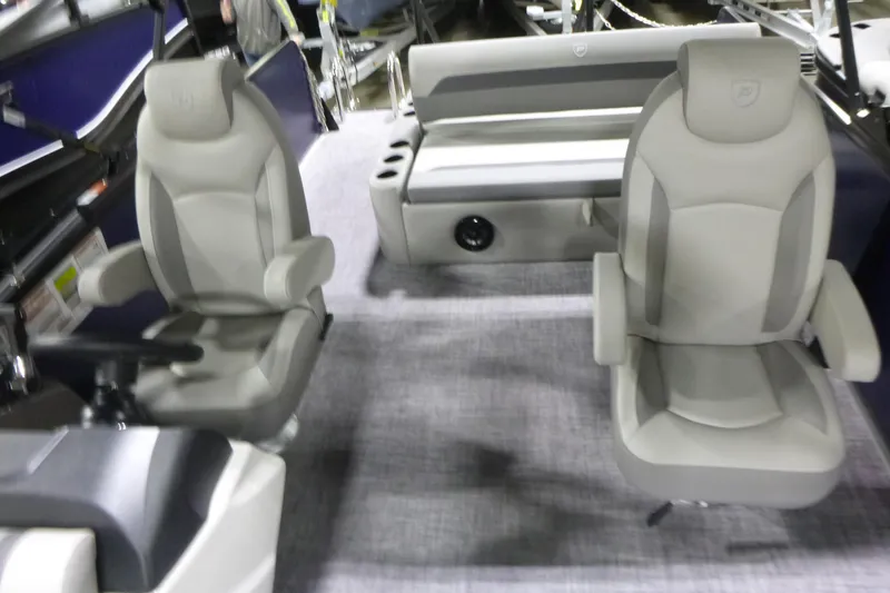 Slide: The Image of 2026 Premier 220 SUNSCAPE RL boat interior with plush seating and modern design. - 12
