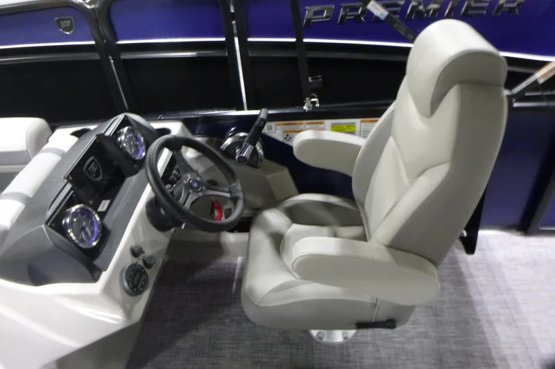 Slide: The Image of Captain's seat and dashboard of 2026 Premier 220 SUNSCAPE RL boat. - 14