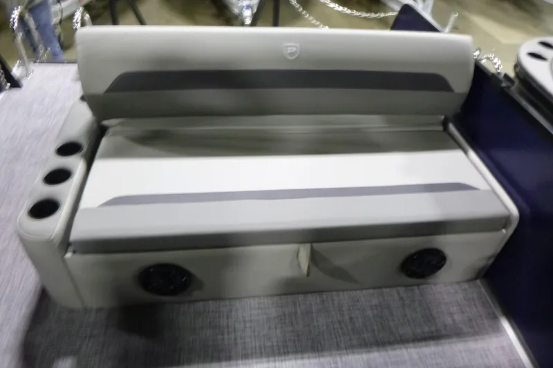 Slide: The Image of 2026 Premier 220 SUNSCAPE RL boat seating with cup holders and speakers. - 17