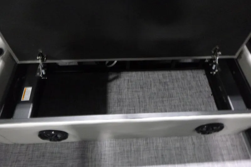 Slide: The Image of Open storage compartment in 2026 Premier 220 SUNSCAPE RL boat interior. - 18