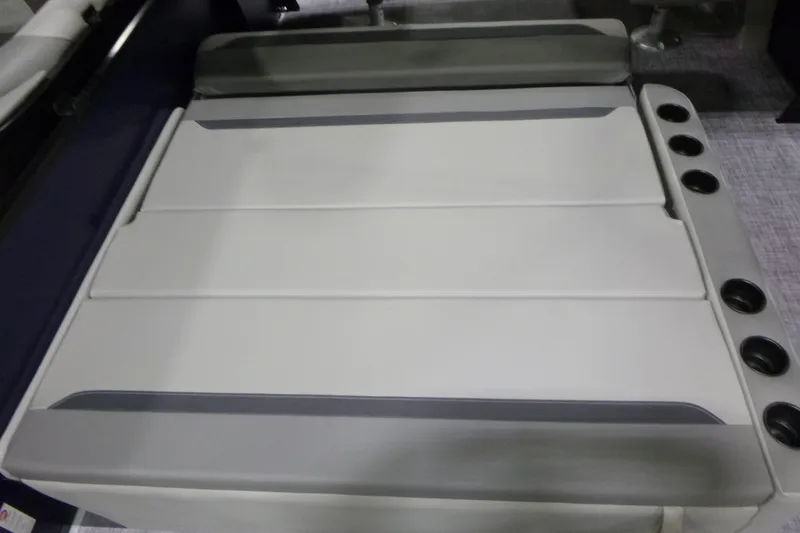 Slide: The Image of 2026 Premier 220 SUNSCAPE RL boat seating with integrated cup holders. - 20