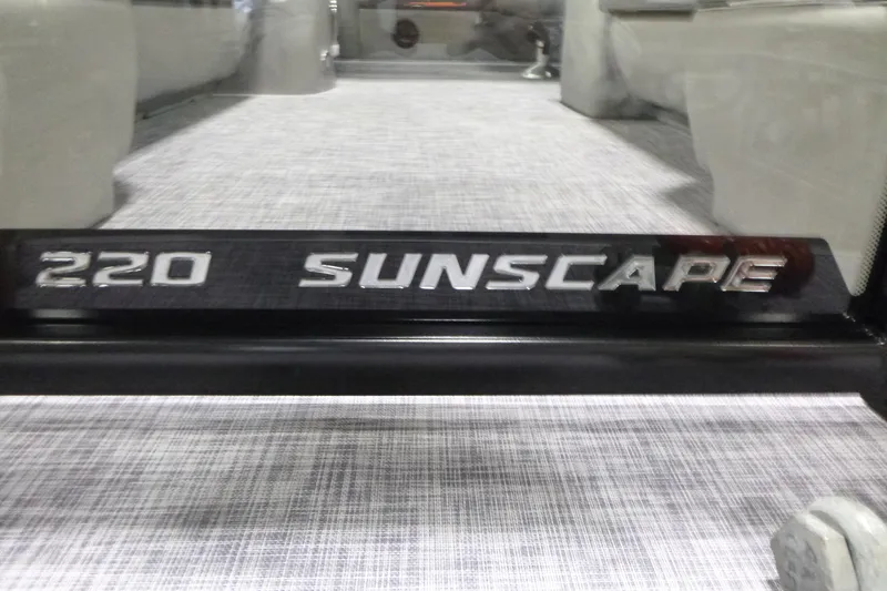 Slide: The Image of 2026 Premier 220 SUNSCAPE RL boat interior with logo detail. - 21