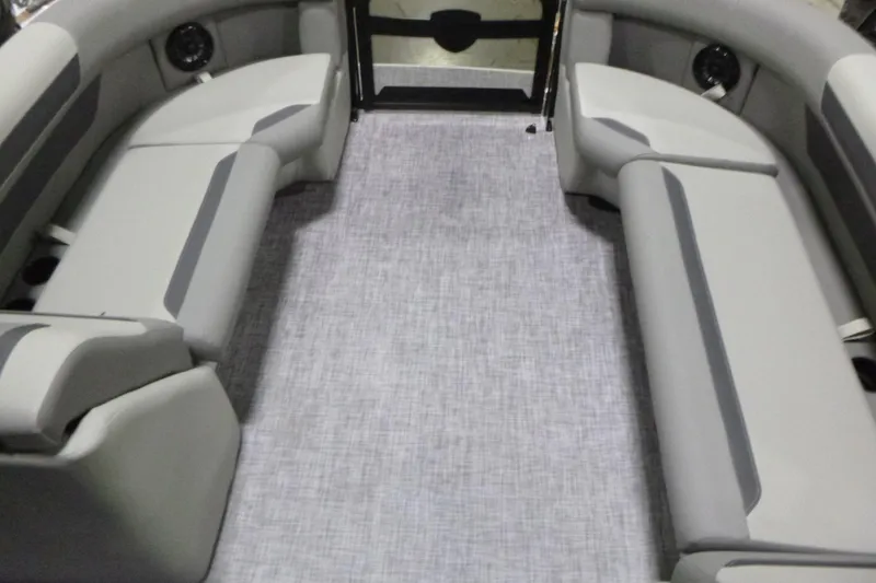 Slide: The Image of 2026 Premier 220 SUNSCAPE RL boat interior with gray seating and carpet flooring. - 6
