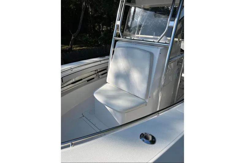 Slide: The Image of 2007 Fountain 23 Center Console boat interior with cushioned seating and stainless steel frame. - 2