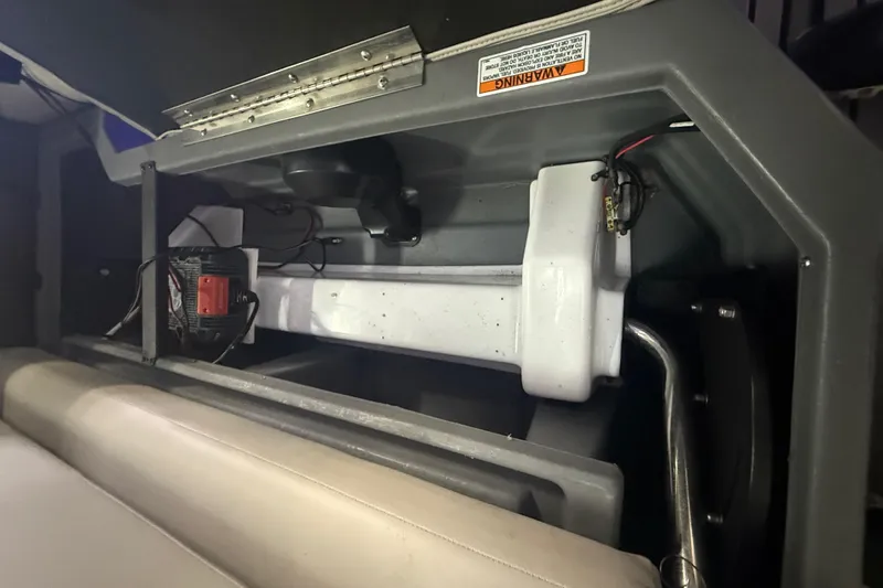 Slide: The Image of Interior view of 2023 Starcraft SLS 3 Q DH boat showing seating and wiring components. - 13