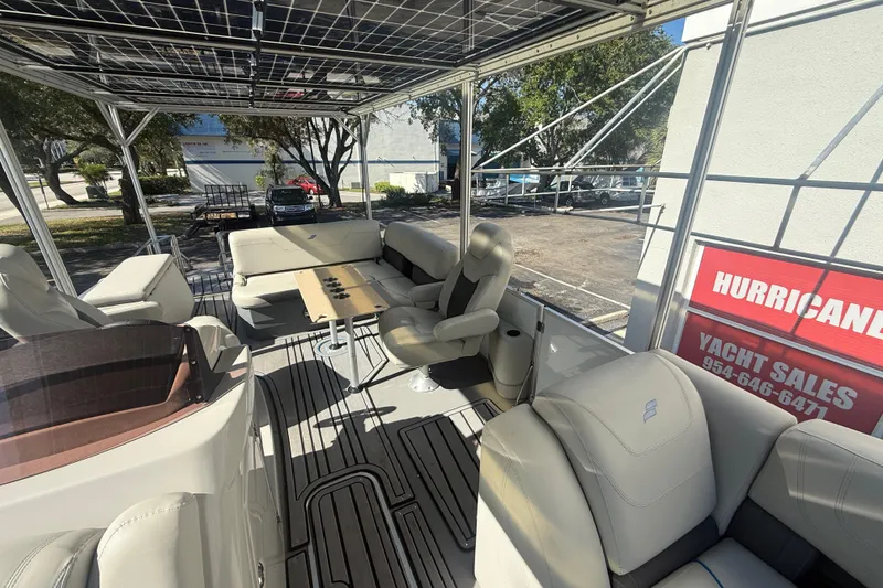 Slide: The Image of 2023 Starcraft SLS 3 Q DH boat interior with seating and table, displayed at yacht sales. - 20