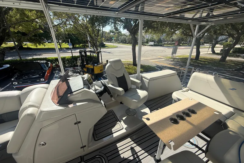 Slide: The Image of Interior of 2023 Starcraft SLS 3 Q DH boat with seating and control panel. - 21