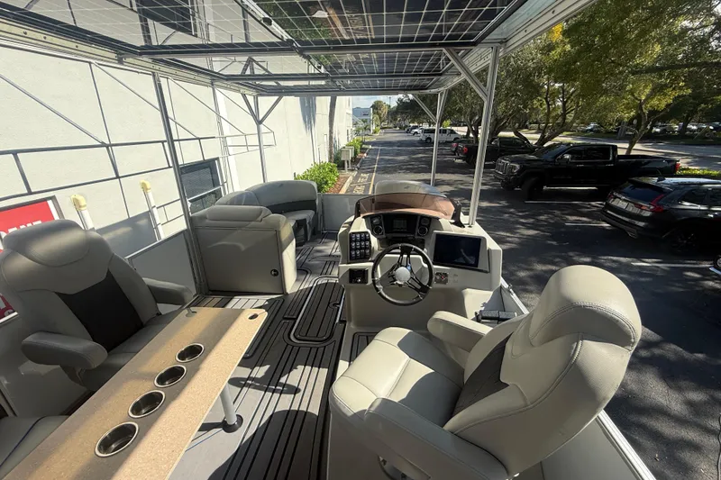 Slide: The Image of Interior view of 2023 Starcraft SLS 3 Q DH boat with seating and control panel. - 22