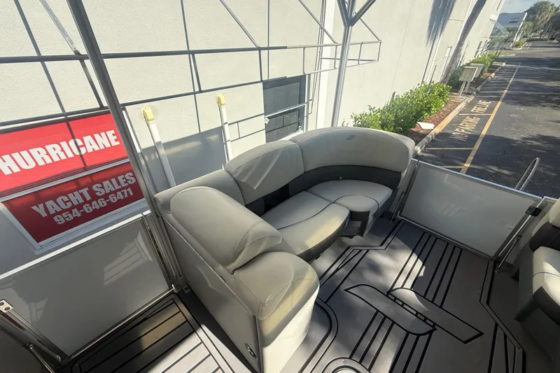 Slide: The Image of 2023 Starcraft SLS 3 Q DH pontoon boat interior with plush seating and modern design. - 23