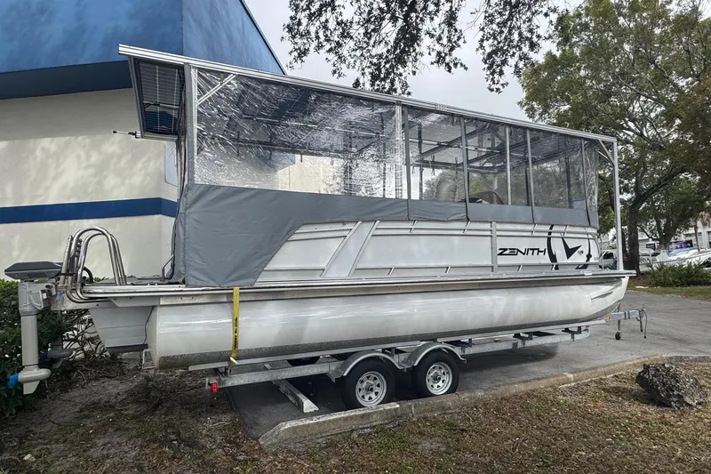Slide: The Image of 2023 Starcraft SLS 3 Q DH pontoon boat with covered deck on a trailer. - 6