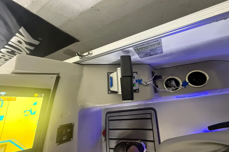 Slide: The Image of 2023 Starcraft SLS 3 Q DH boat dashboard with controls and navigation screen. - 9