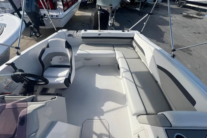 Slide: The Image of 2022 Starcraft SVX 191 OB boat interior with seating and steering wheel. - 10