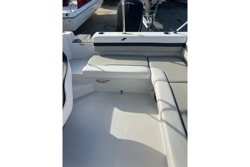 Slide: The Image of 2022 Starcraft SVX 191 OB boat interior with cushioned seating and sleek design. - 12