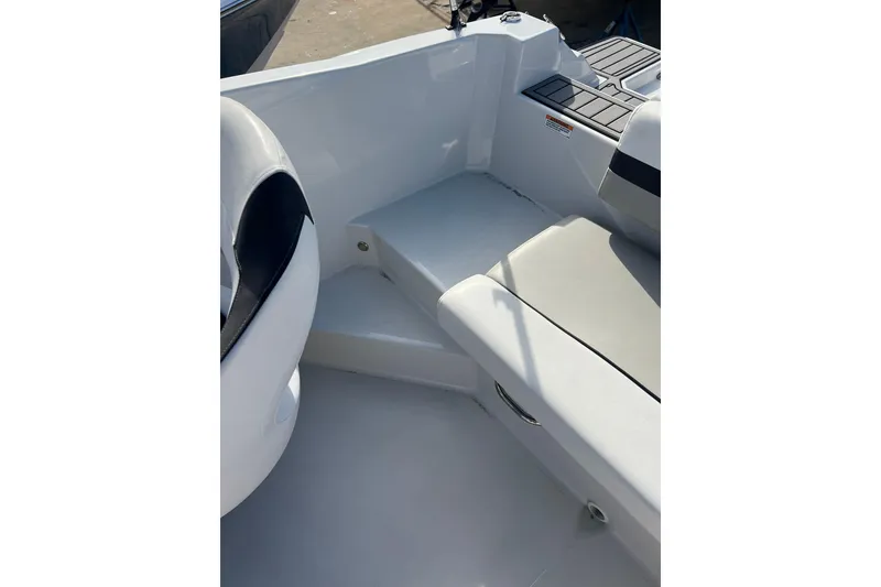 Slide: The Image of 2022 Starcraft SVX 191 OB boat interior with seating and step detail. - 14