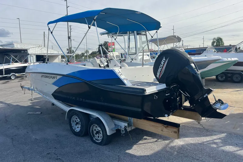 Slide: The Image of 2022 Starcraft SVX 191 OB boat with Mercury outboard motor on trailer. - 2