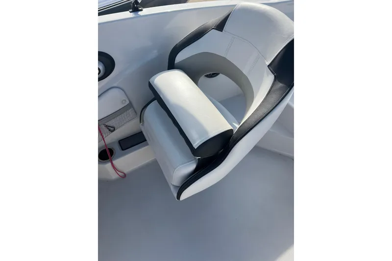 Slide: The Image of Captain's seat in 2022 Starcraft SVX 191 OB boat, featuring sleek design and comfort. - 6