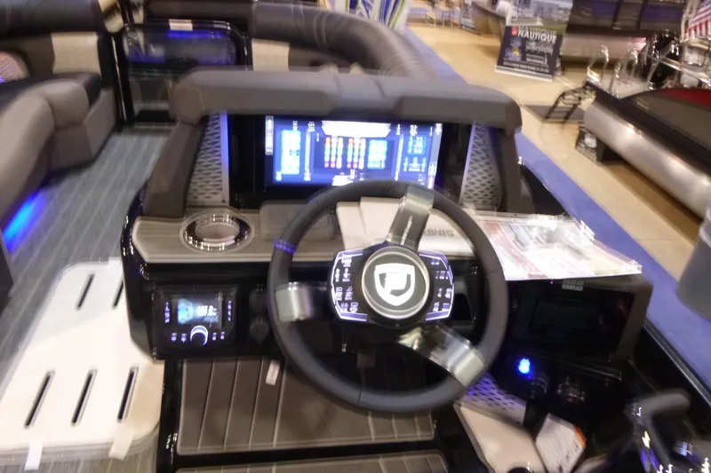 Slide: The Image of Cockpit of 2026 Premier 230 Intrigue RLO with modern steering and digital controls. - 14
