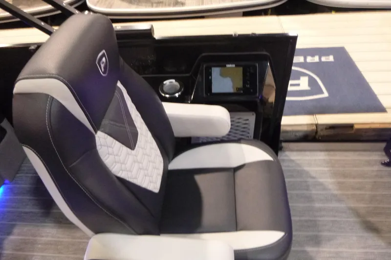 Slide: The Image of Captain's chair and console of 2026 Premier 230 Intrigue RLO boat. - 15