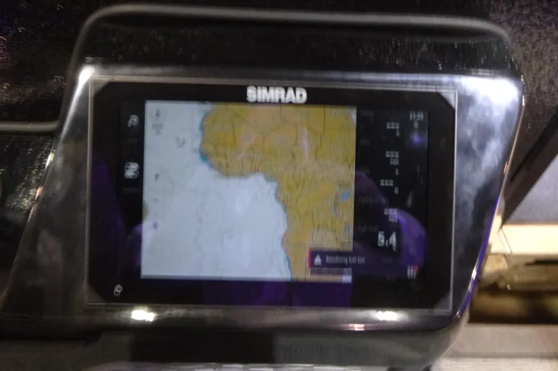 Slide: The Image of Simrad navigation display on 2026 Premier 230 Intrigue RLO boat dashboard. - 16