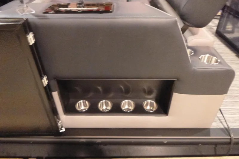 Slide: The Image of Premier 230 Intrigue RLO 2026 boat interior with cup holders and seating. - 20