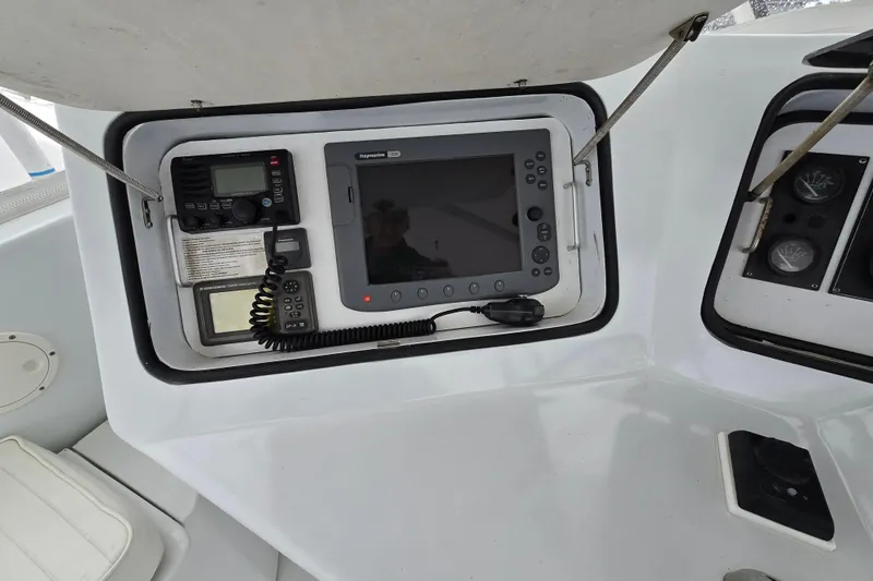Slide: The Image of Control panel of a 2000 Custom 42 JM Sportfish boat with navigation equipment. - 16