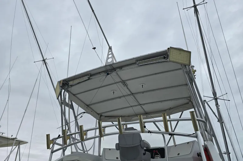 Slide: The Image of Custom 42 JM Sportfish Custom boat, 2000 model, featuring a sturdy fishing tower and antennas. - 26