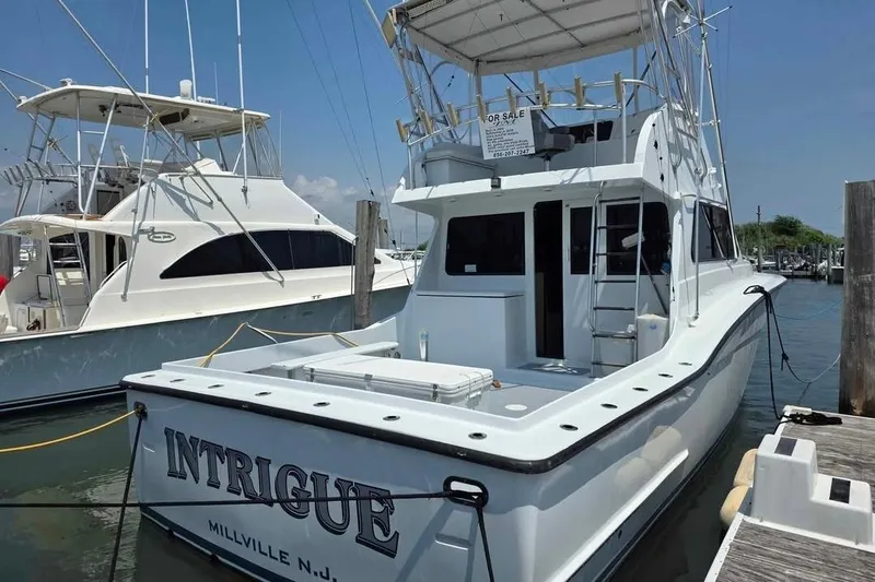 Slide: The Image of 2000 JM Custom 42 boat named "Intrigue" docked in Millville, NJ marina. - 4