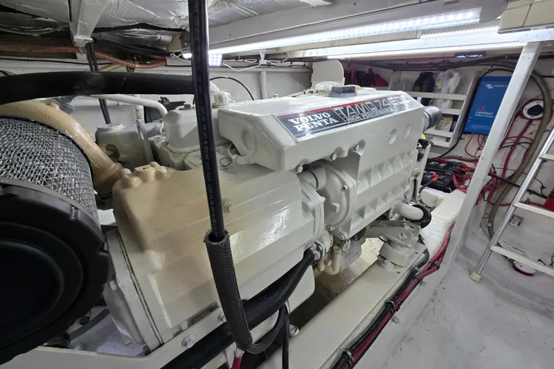 Slide: The Image of Engine room of 2000 Custom 42 JM Sportfish with Volvo Penta TAMD 74P engine. - 42