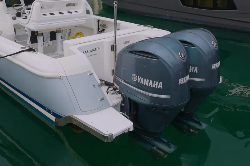 Slide: The Image of 2014 Intrepid 327 Cuddy with dual Yamaha engines docked in marina. - 5
