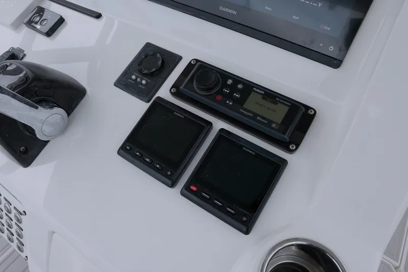 Slide: The Image of Control panel of a 2014 Intrepid 327 Cuddy boat with Garmin electronics. - 8