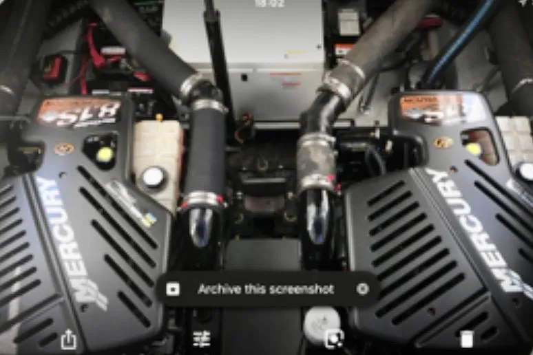 Slide: The Image of Engine compartment of a 2002 Wellcraft 3300 Martinique with dual Mercury engines. - 19