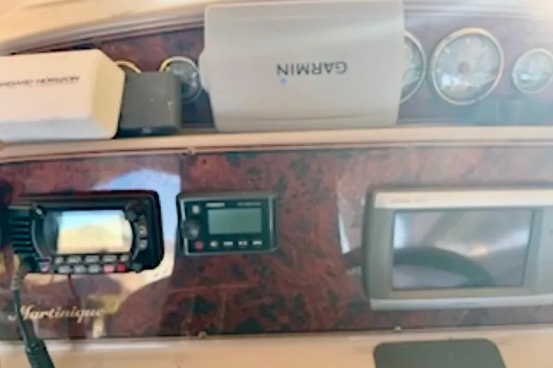Slide: The Image of Dashboard of a 2002 Wellcraft 3300 Martinique boat with Garmin navigation equipment. - 4