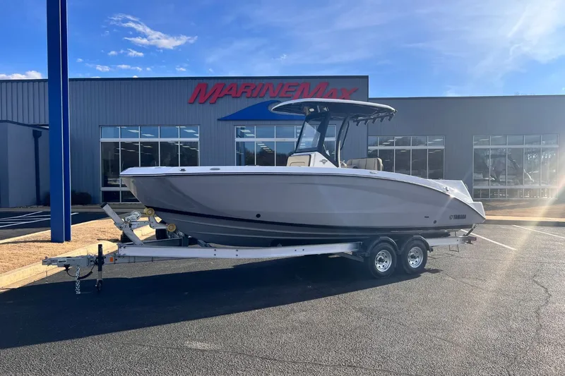 Slide: The Image of 2026 Yamaha 255 FSH Sport E boat in front of MarineMax building. - 0