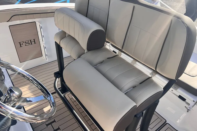 Slide: The Image of Yamaha 255 FSH Sport E 2026 boat seat and helm area. - 11