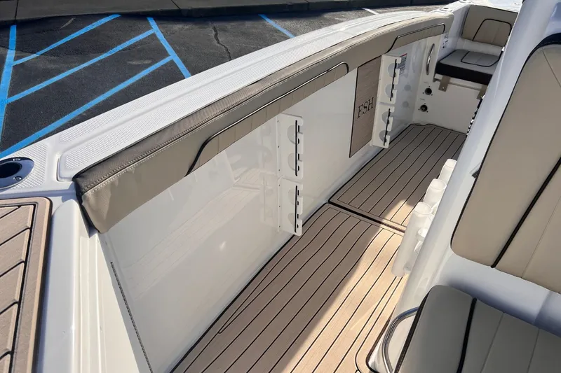 Slide: The Image of Interior of Yamaha Boats 255 FSH Sport E 2026 with cushioned seating. - 15