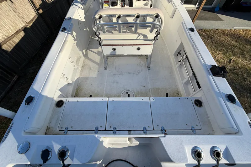 Slide: The Image of 2015 Sea Hunt Ultra 225 boat interior with seating and storage compartments. - 19